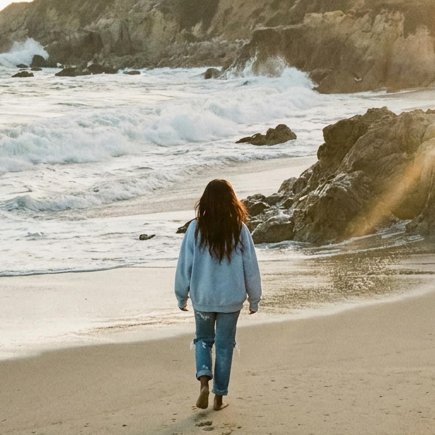 California coastline with ocean waves, rocky shorline and coastal golden hour