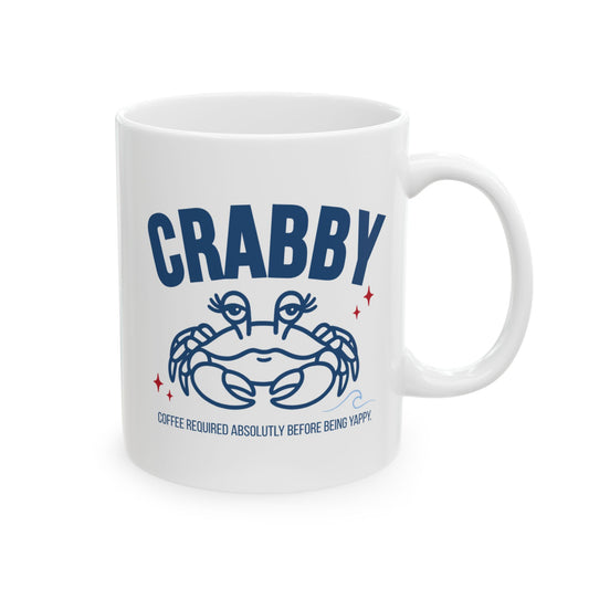 White coffee mug featuring a blue crab illustration and “Crabby” coffee-themed design
