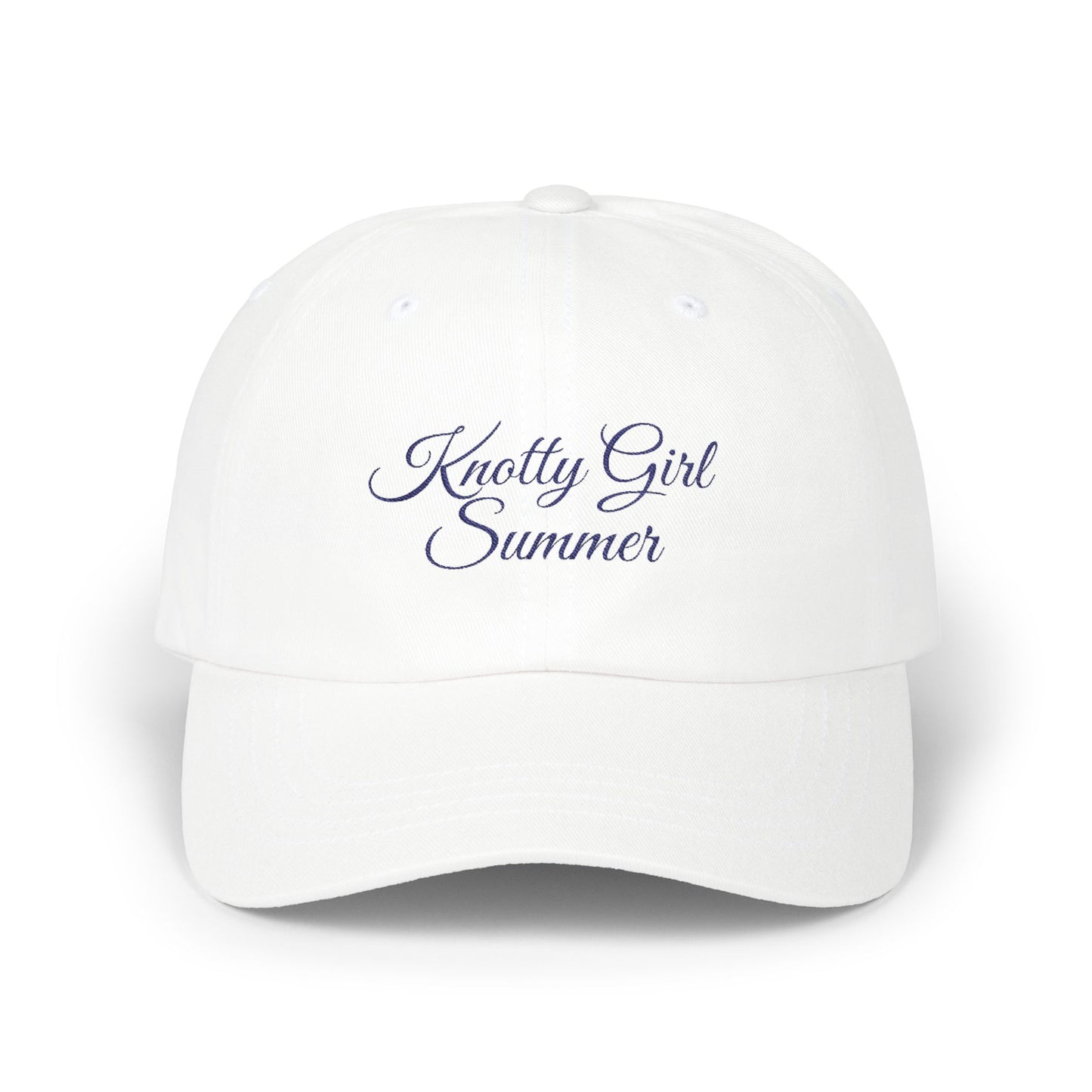 close up of navy embroidered Knotty Girl Summer design on hat.